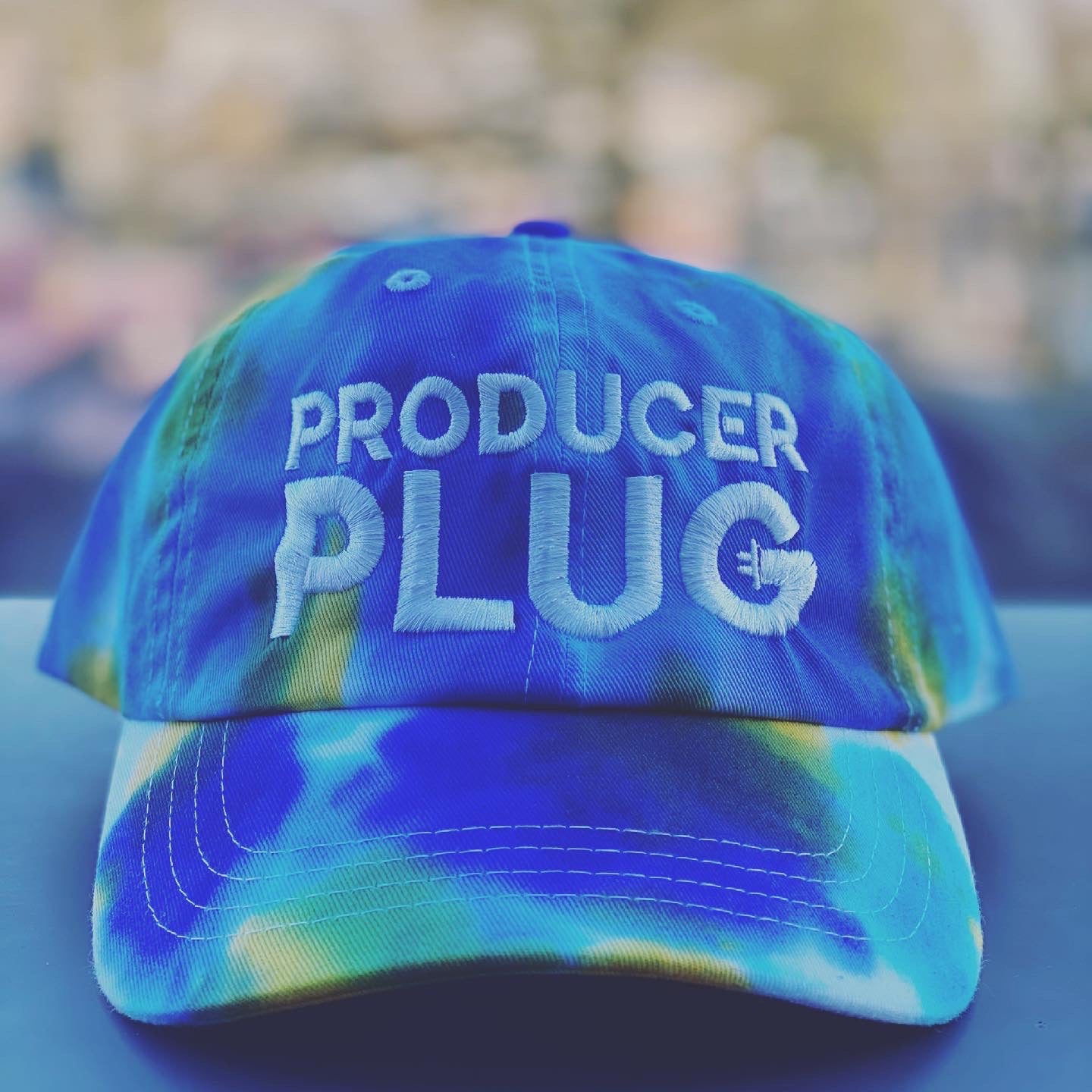 PRODUCER PLUG TYE DYE  BLUE, TURQUOISE , YELLOW & WHITE DAD BACK ( WHITE TEXT)